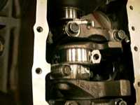Closeup of crank with piston caps.
